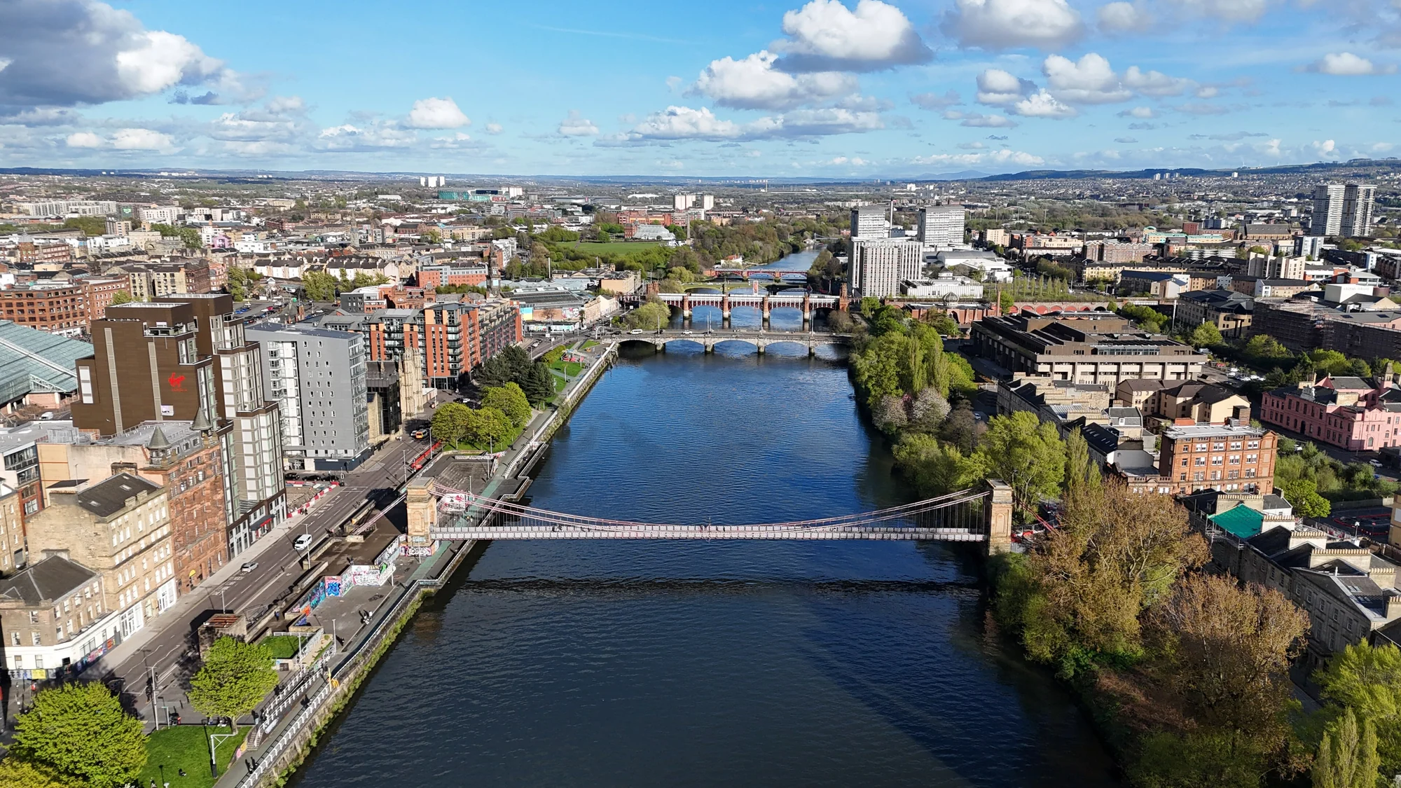 An aerial view of the River Clyde, bridges and buildings in central Glasgow
